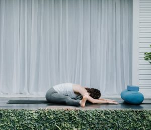 Bali Yoga Retreats yoga flow for reducing anxiety wide legged forward seated fold