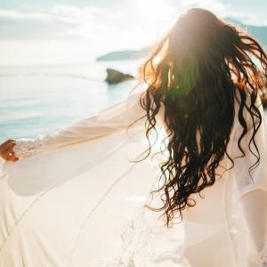 a woman's awakening solo travel beach meditation